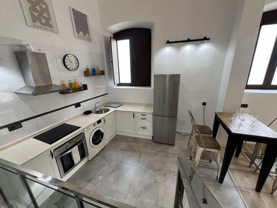 Kitchen or kitchenette, dishwasher, oven, stove, toaster, washing machine, dryer