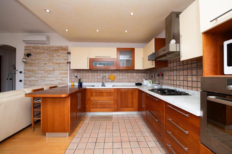Kitchen or kitchenette, dishwasher, oven, stove
