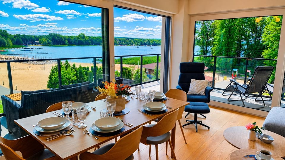 View (from property/room), Balcony/Terrace, Living room, Seating area, Beach, Lake view