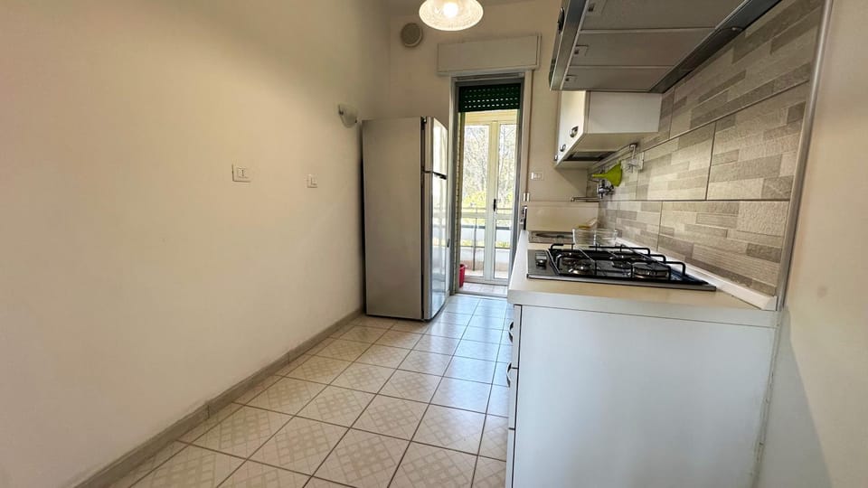 Kitchen or kitchenette, dishwasher, oven, stove