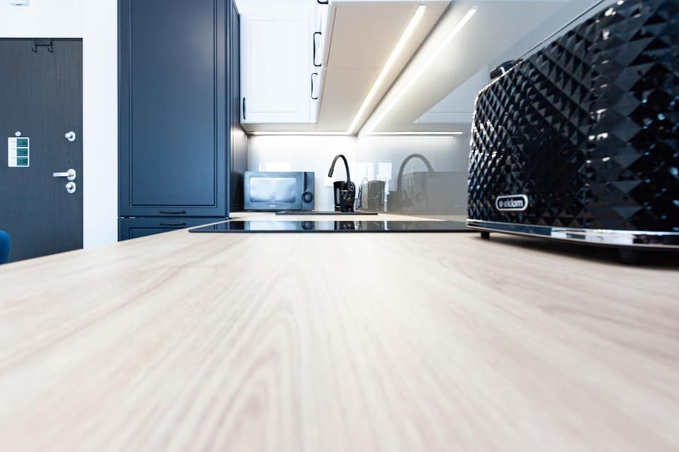 Kitchen or kitchenette, microwave, stove, toaster
