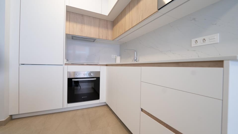 Kitchen or kitchenette, dishwasher, microwave, oven, stove