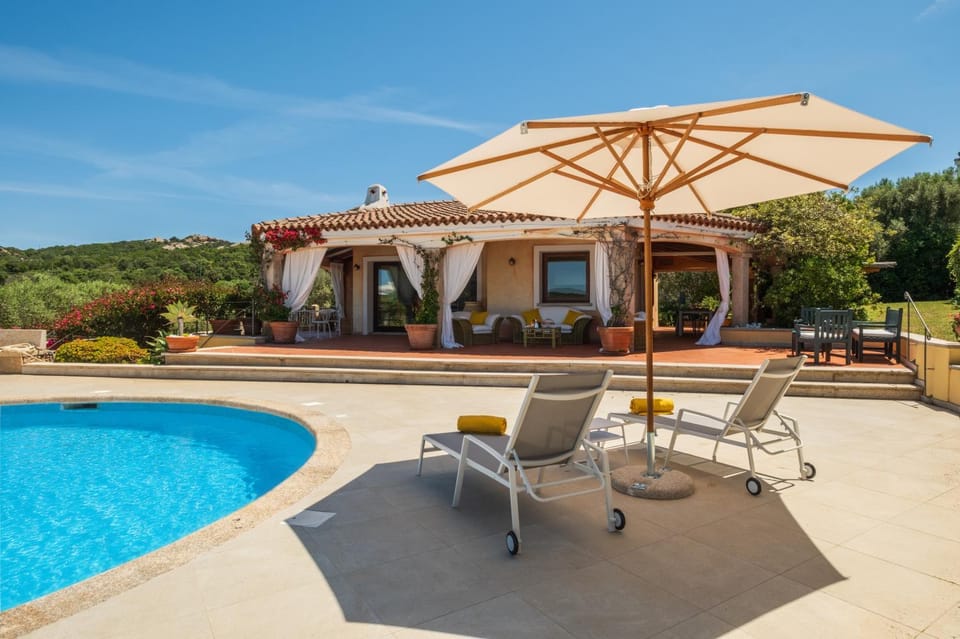 Property building, Patio, Day, Natural landscape, Garden, Living room, Seating area, Garden view, Pool view, Sea view, Swimming pool, sunbed