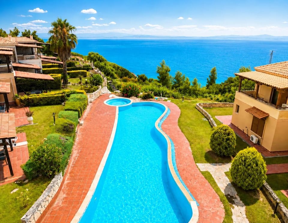 Property building, Nearby landmark, Spring, Day, Natural landscape, Garden, Garden view, Pool view, Sea view, Swimming pool