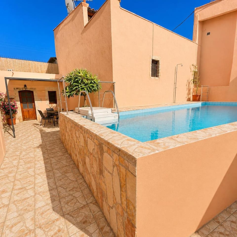 Property building, Patio, Day, Pool view, Swimming pool