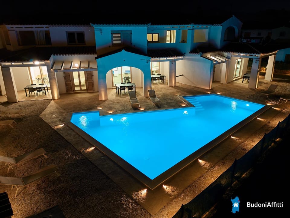 Property building, Patio, Night, Pool view, Swimming pool, sunbed