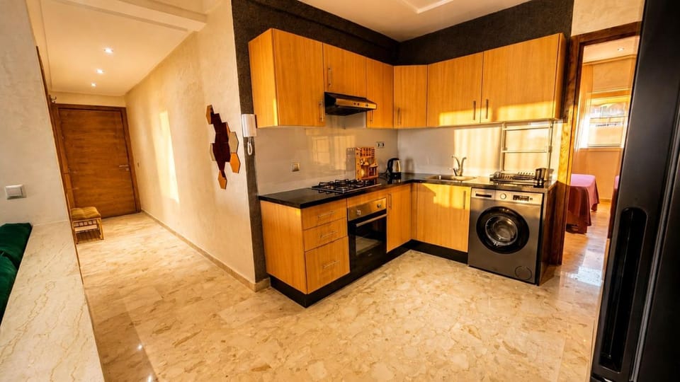 Kitchen or kitchenette, oven, stove, washing machine, dryer
