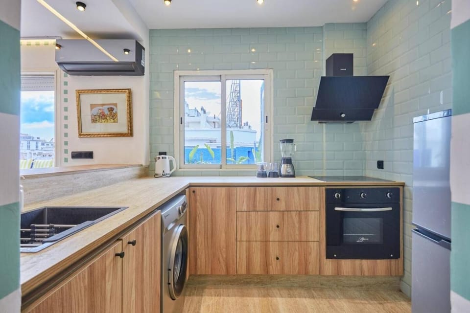 Kitchen or kitchenette, dishwasher, oven, stove