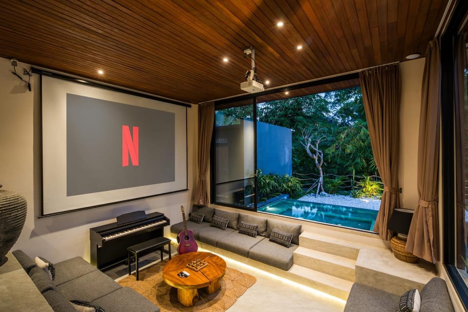 Living room, Seating area, Garden view, Pool view