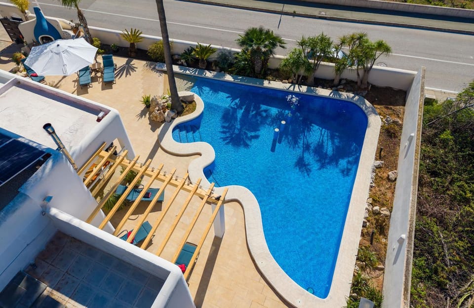 Property building, Living room, Swimming pool