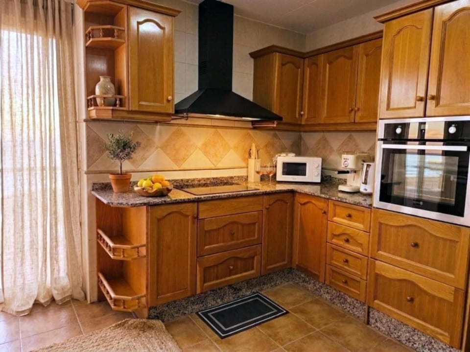 Kitchen or kitchenette, oven, stove