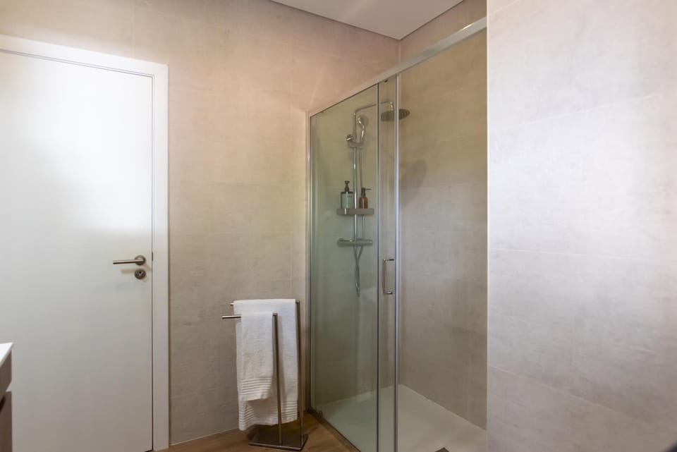 Shower, Bathroom, hair dryier, towels