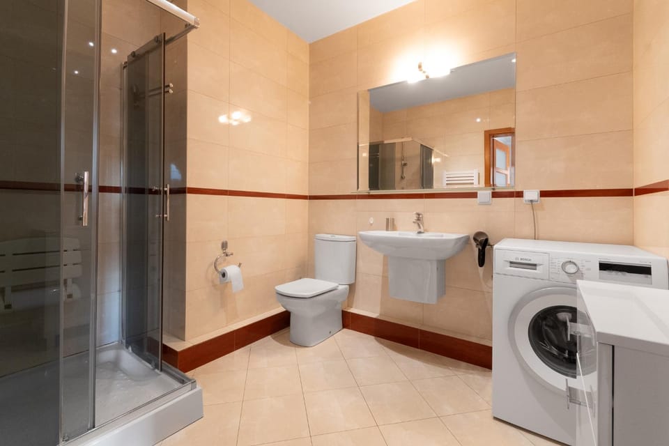 Shower, Toilet, Bathroom, towels, washing machine, dryer