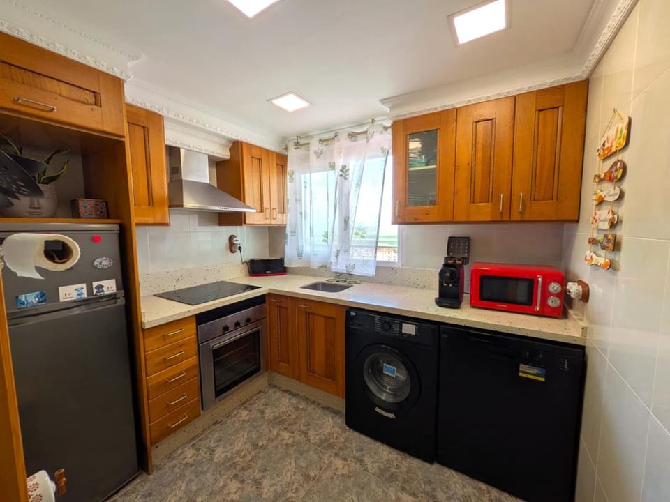Kitchen or kitchenette, microwave, oven, stove, kitchen