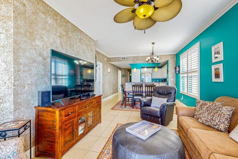 Beachfront condo with beach chairs an umbrella and a pool House in Okaloosa Island