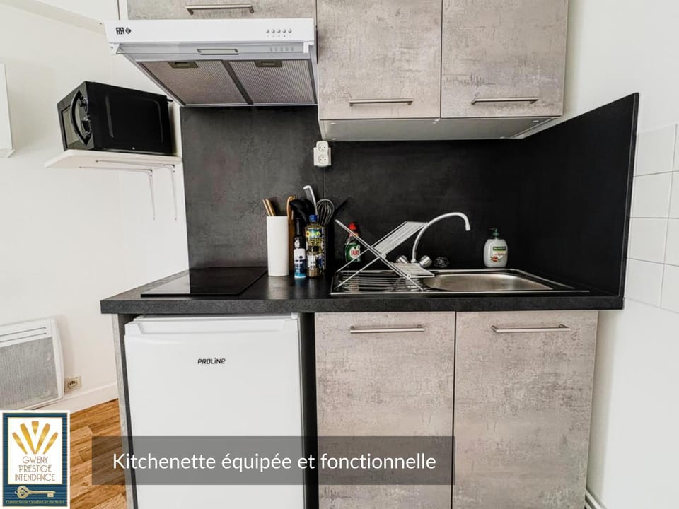 Kitchen or kitchenette, microwave, storage, stove