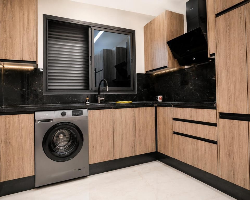 Kitchen or kitchenette, stove, washing machine