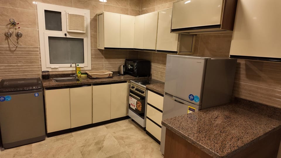 Kitchen or kitchenette, oven, stove, toaster