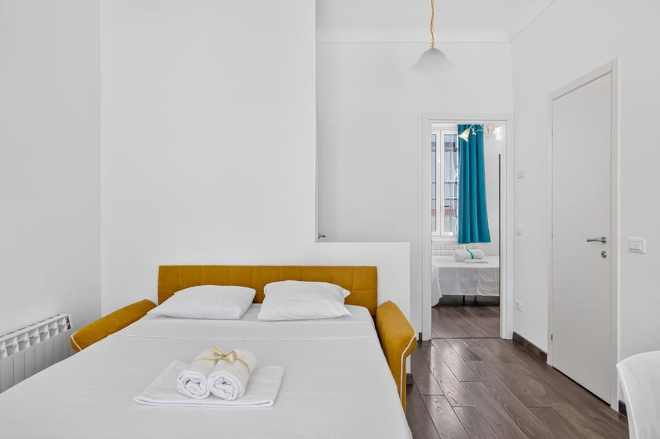 Bed, towels, wardrobe
