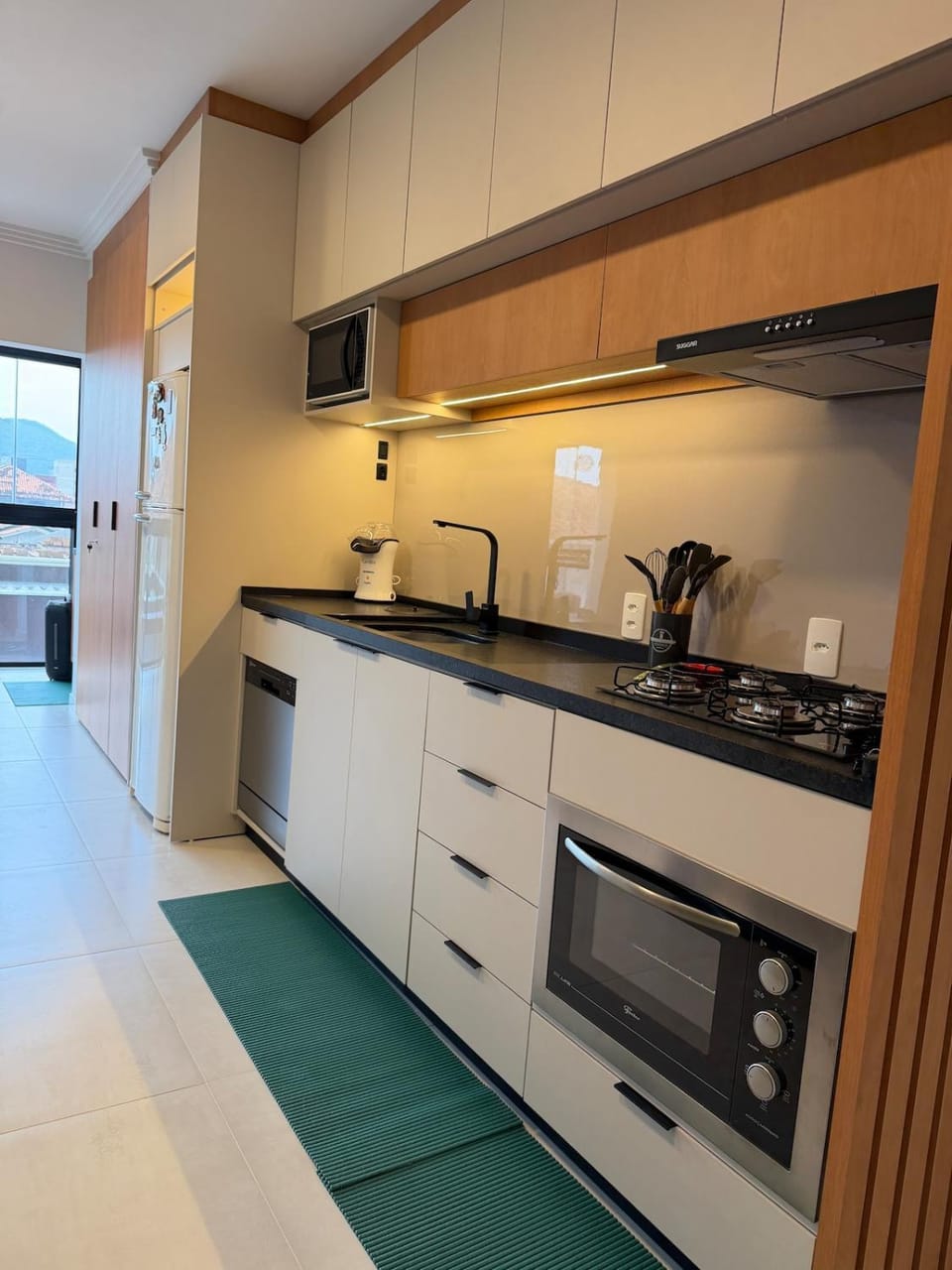 Kitchen or kitchenette, dishwasher, oven, stove