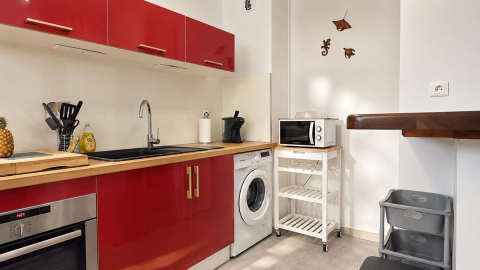 Kitchen or kitchenette, microwave, oven, stove, washing machine