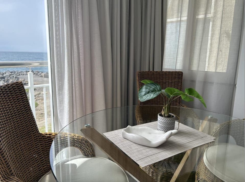 Natural landscape, View (from property/room), Living room, Seating area, Dining area, Sea view
