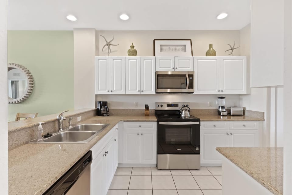Kitchen or kitchenette, dishwasher, oven, stove, toaster