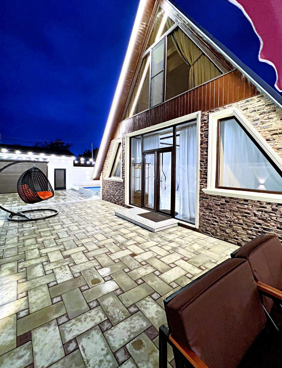 Property building, Patio, Night, Living room, Seating area