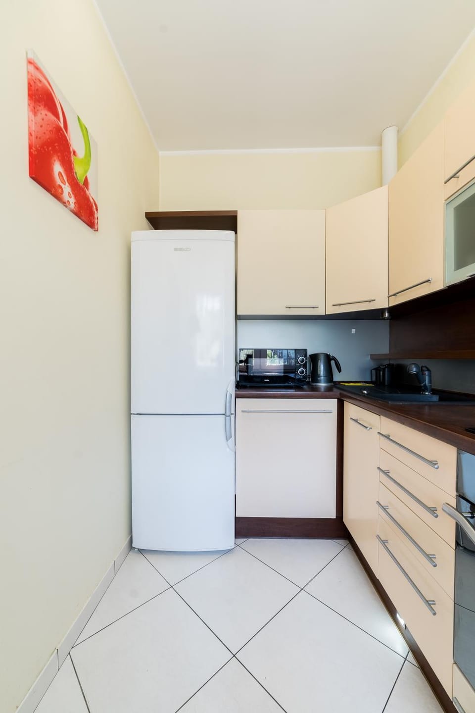 Kitchen or kitchenette, dishwasher, oven, stove