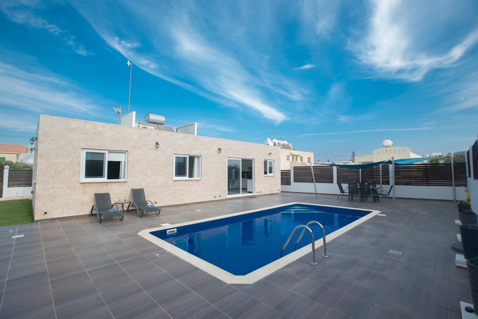 Property building, Garden, Seating area, Swimming pool