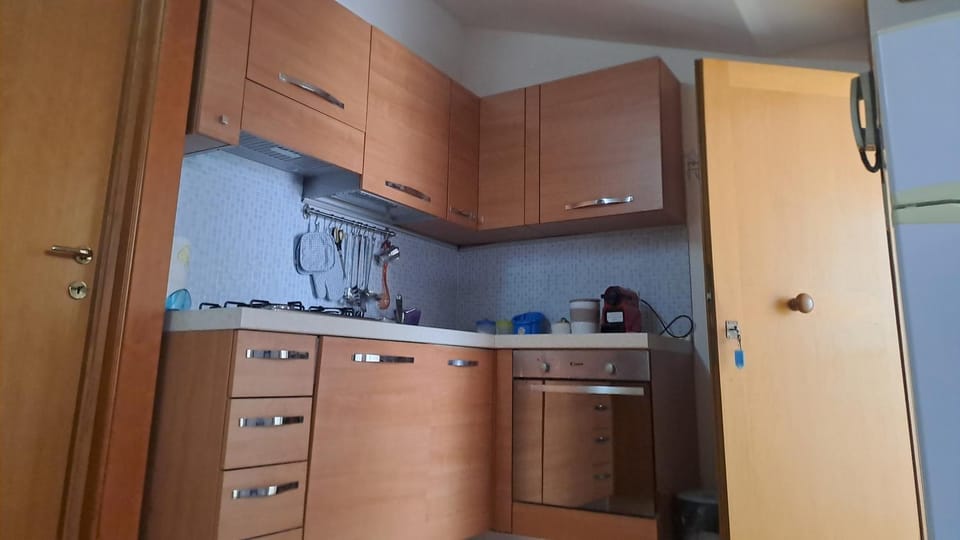 Kitchen or kitchenette, oven, stove