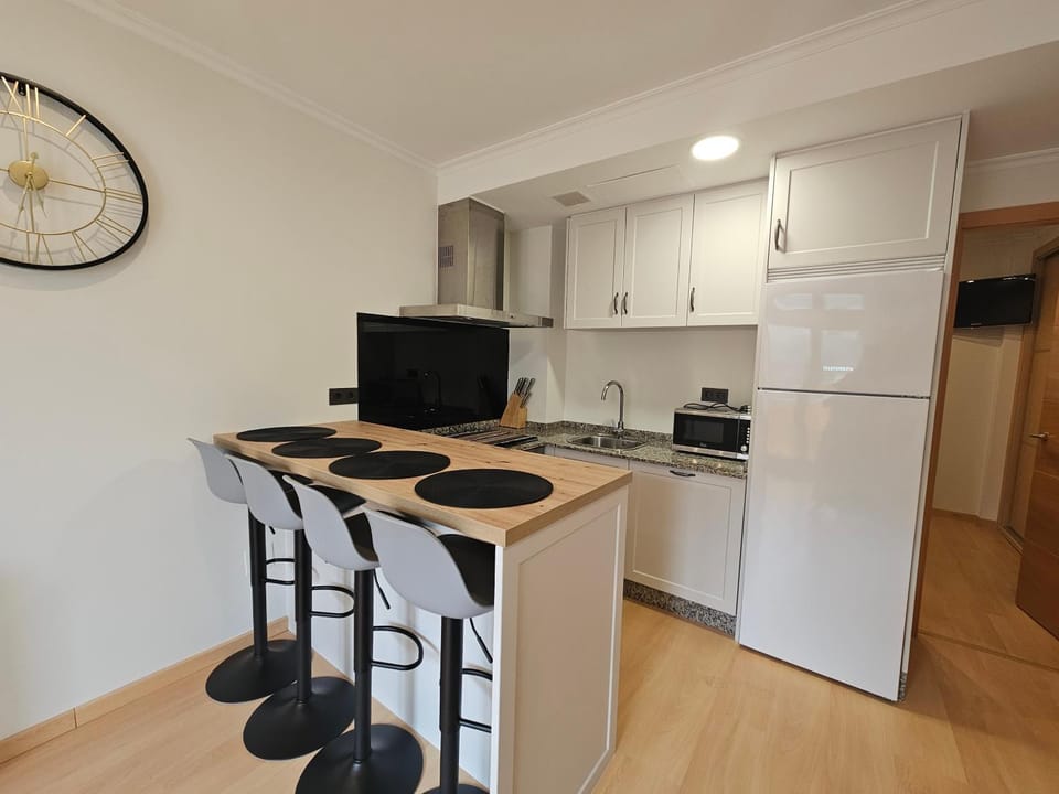 Kitchen or kitchenette, stove, toaster