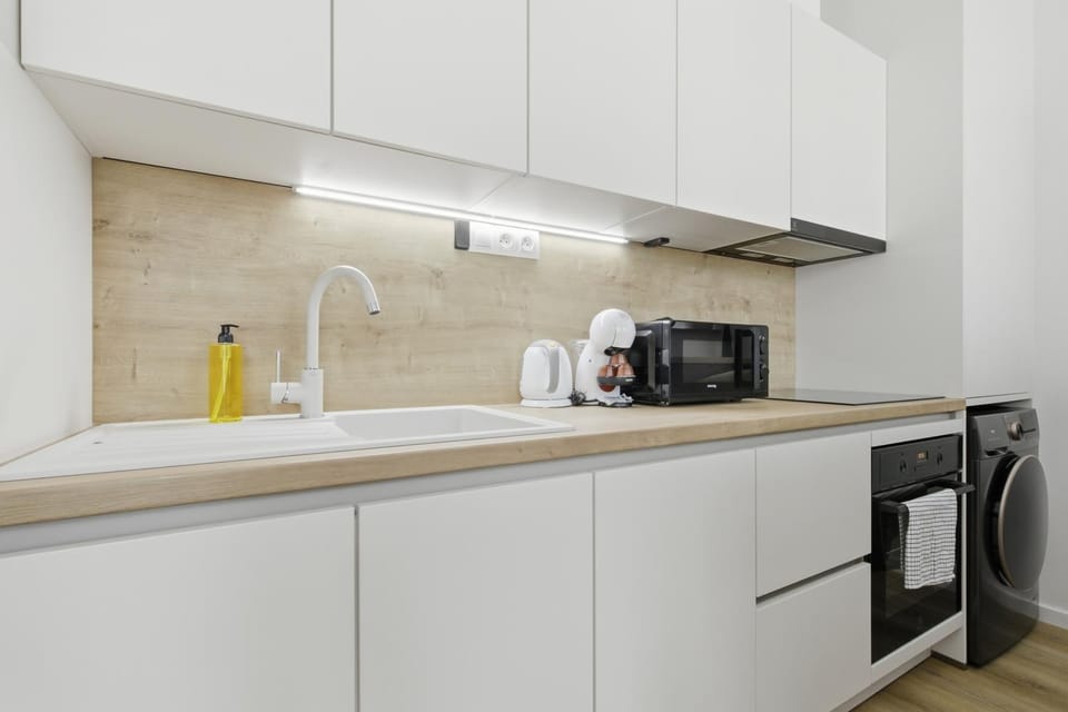 Kitchen or kitchenette, dishwasher, oven, stove, washing machine