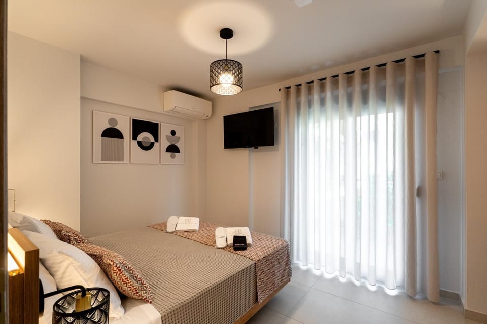 Bed, TV and multimedia, Seating area, Bedroom, towels, wardrobe, air conditioner