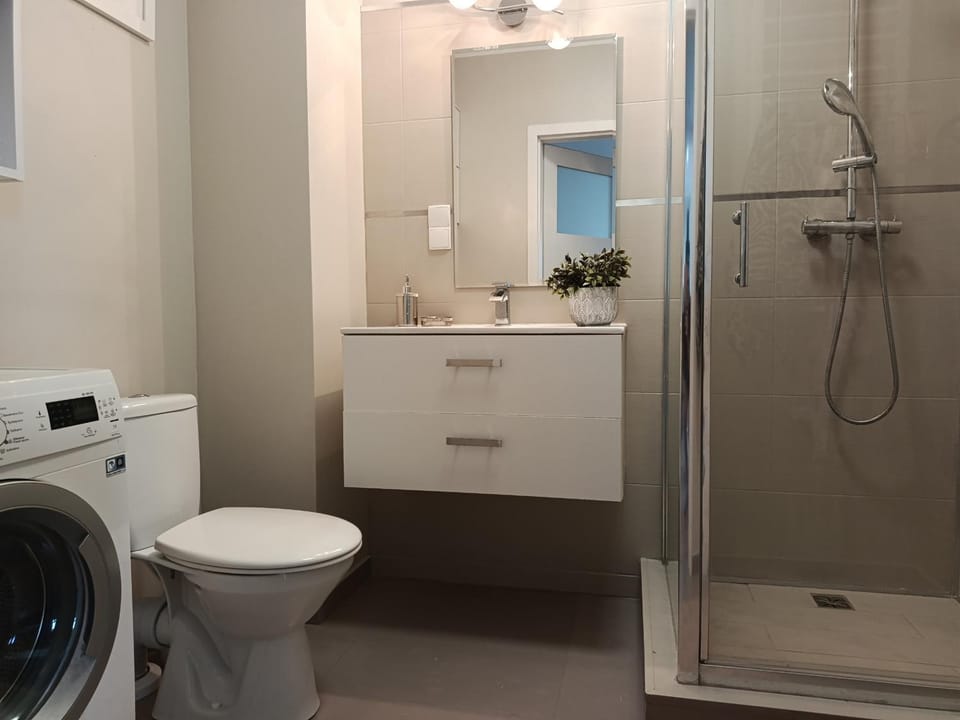Shower, Toilet, Bathroom, towels, washing machine, dryer