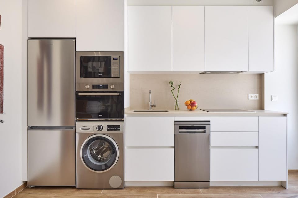 Kitchen or kitchenette, dishwasher, oven, stove, washing machine