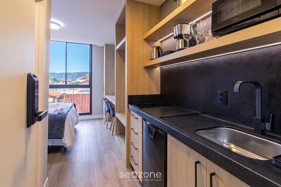 View (from property/room), Kitchen or kitchenette, Seating area, Bedroom
