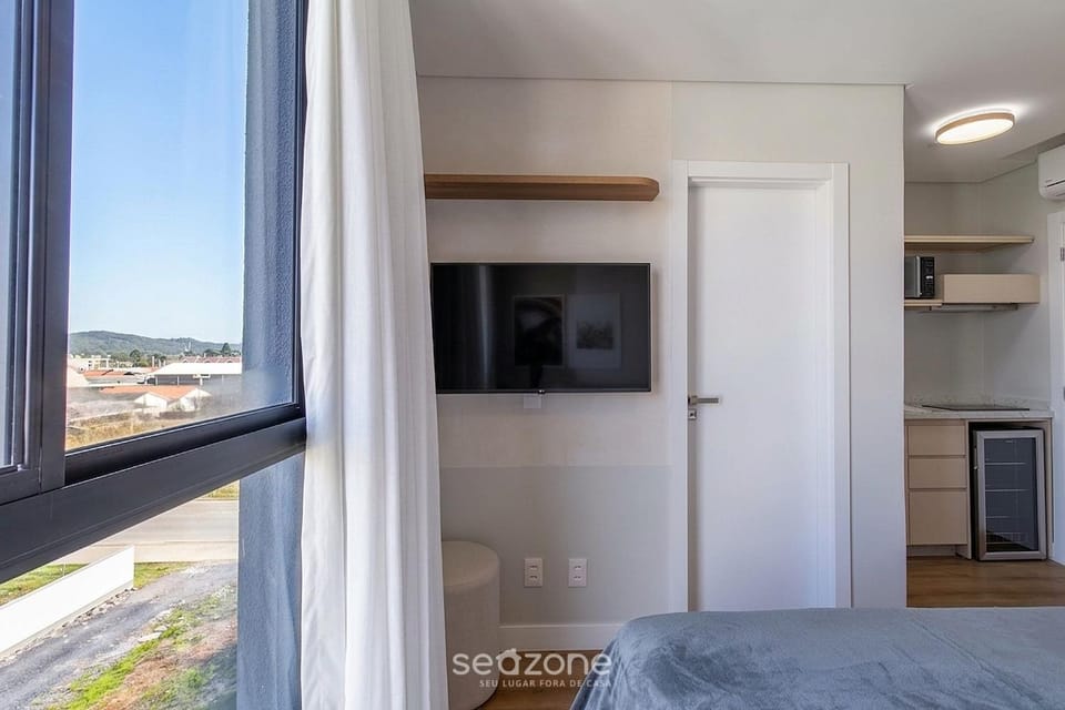 TV and multimedia, View (from property/room), Kitchen or kitchenette, Seating area, Bedroom