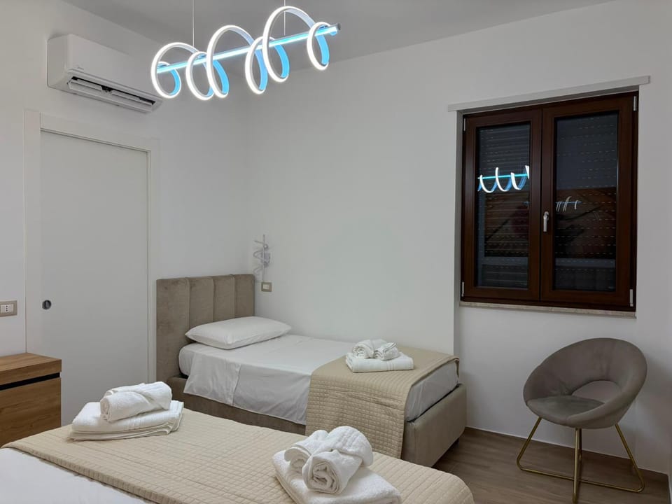 Bed, Photo of the whole room, Bedroom, towels, air conditioner