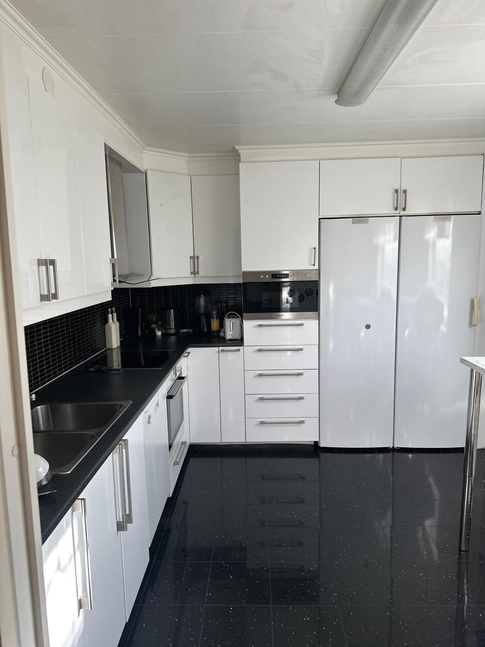 Kitchen or kitchenette, dishwasher, oven, stove