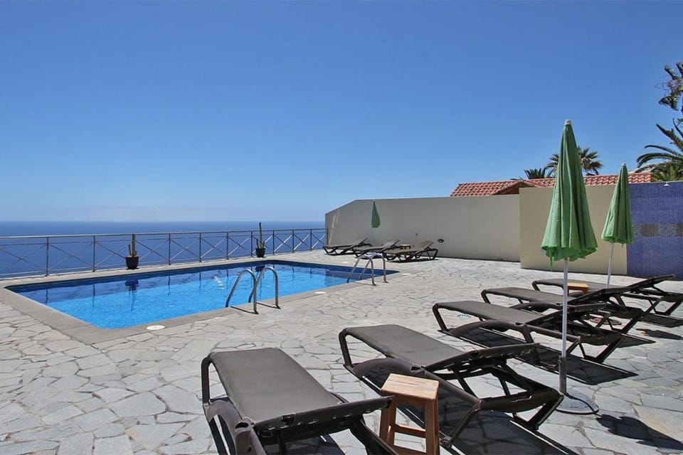 Property building, Living room, Swimming pool