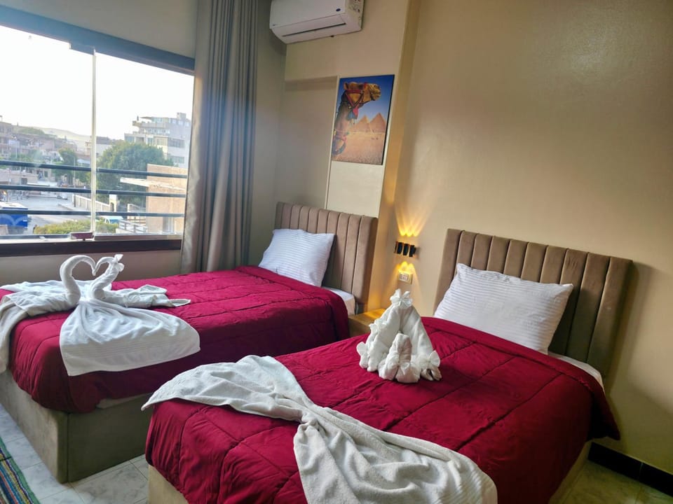 Bed, Photo of the whole room, Bedroom, towels, air conditioner