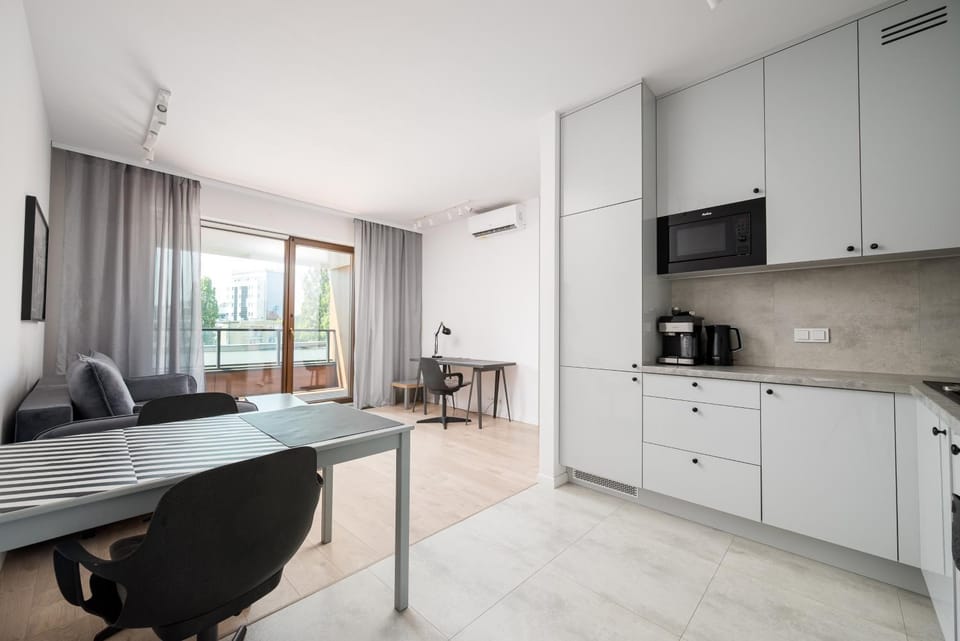 TV and multimedia, Kitchen or kitchenette, Living room, Seating area, Dining area, stove, air conditioner