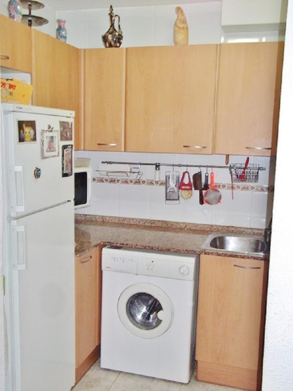 Kitchen or kitchenette, washing machine