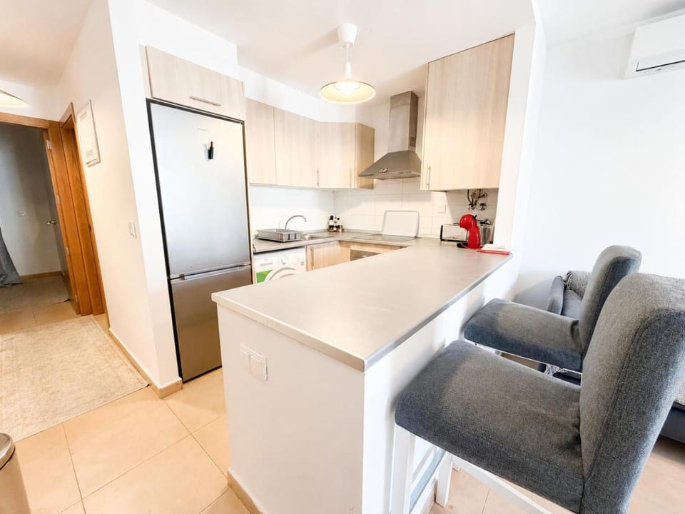 Kitchen or kitchenette, stove, washing machine