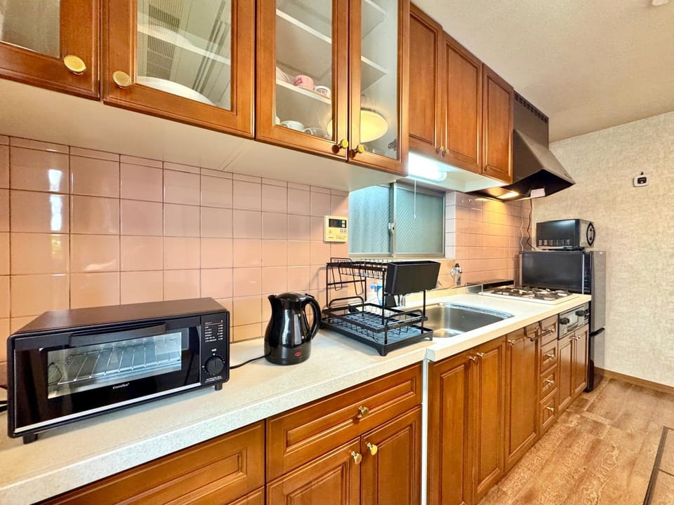 Kitchen or kitchenette, stove, toaster