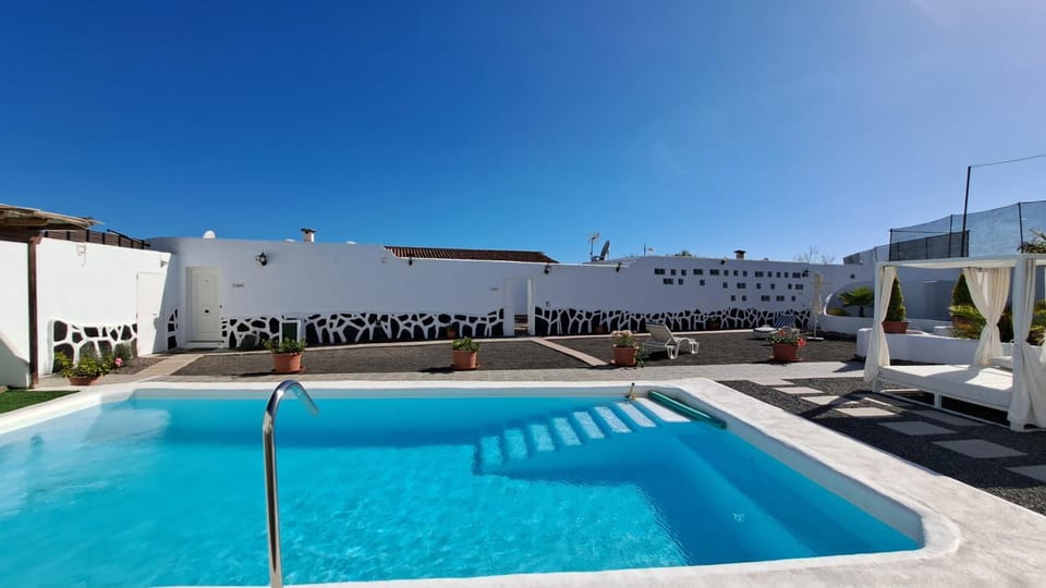 Property building, Living room, Swimming pool