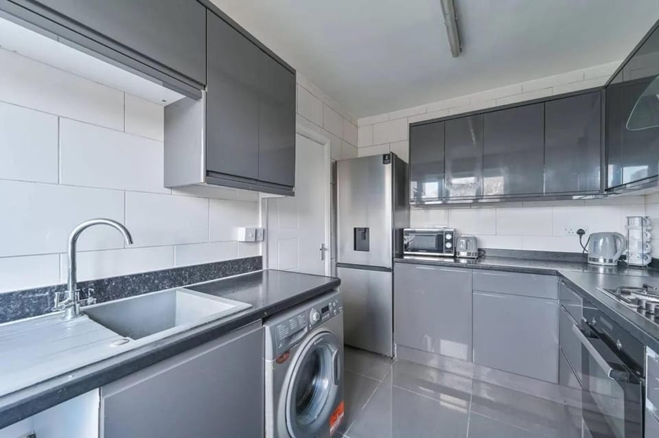 Kitchen or kitchenette, microwave, oven, stove, washing machine