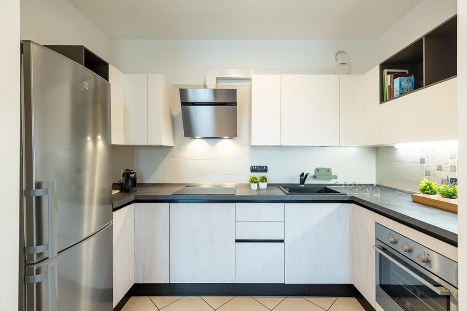 Kitchen or kitchenette, dishwasher, oven, stove