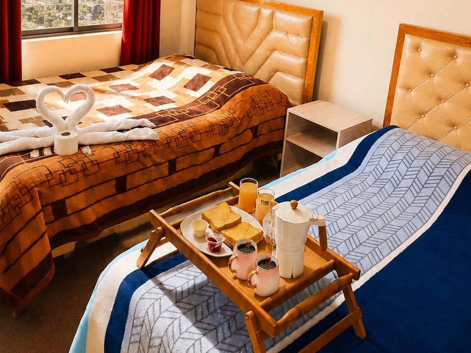 Bed, Living room, Food and drinks, Photo of the whole room, Seating area, Bedroom, Food, Breakfast, Continental breakfast, towels